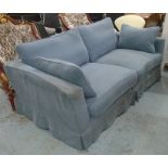 SOFA, two seater, with a loose blue covering and duck down cushions on simple turned feet,