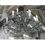 CHANDELIER, twelve light with faceted drops, approx 64cm H.