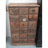 WOODEN CHEST, with eighteen drawers, antique wooden finish, 67cm x 36cm x 110cm.