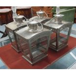 CANDLEHOLDERS, a set of four, Moorish style, antique silver finish, 27cm x 30cm each.