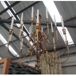 CHANDELIER, gilt, two tier, each with eight branches and tassel detail, 93cm W x 81cm H.