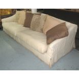 SOFA BY ROCHE BOBOIS, with a large neutral linen cover and selection of various scatter cushions,