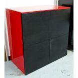 ITALIAN CABINET, Italian red lacquered and black with four flush panelled doors,
