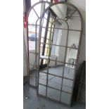 GARDEN MIRRORS, a pair, with domed tops, in a distressed effect metal frame, 158cm x 56cm.