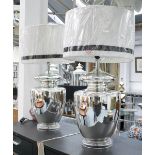 TABLE LAMPS, a pair, urn shaped in chromed finish, with shades, 77cm H.