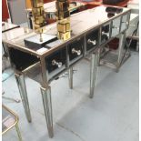 MIRRORED SIDEBOARD, with six short drawers below on six square supports, 150cm x 40cm x 90cm H.