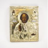 RUSSIAN ICON, depicting St Nicholas, the hallmarked silver okald with two enamel mame tablets, 26.