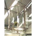 HANGING LANTERN, by Baker Regency style, having a bronze frame with inset glass panels,