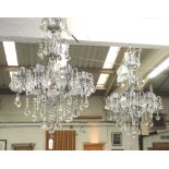 CHANDELIERS, a pair, eight branch with glass drops on a chromed metal frame, 87cm H plus chain.