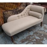 CHAISE LONGUE, in neutral fabric button back on turned castor supports, 135cm L.
