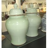 LIDDED URNS, a pair, in celadon glaze Chinese style, 74cm H.