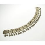 ORNATE BELTS, of Middle Eastern origin, silver coloured metal with faux jewel detail, approx.