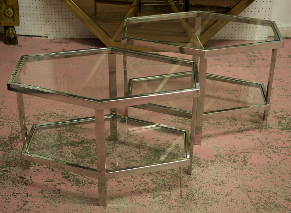 LOW OCCASIONAL TABLES, a pair, two tier, angled shaped chrome framed with glass tops, 60cm W x 40.