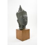 THAI BRONZE HEAD, mounted on a wooden block stand, 41cm H overall.