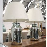 HECTOR FINCH LAMPS, a pair, silvered converted urn bases with ivory coloured shades.