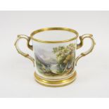 ROYAL WORCESTER LOVING CUP, painted opposding lakeside landscape scenes, gilt detail, 11cm diam.