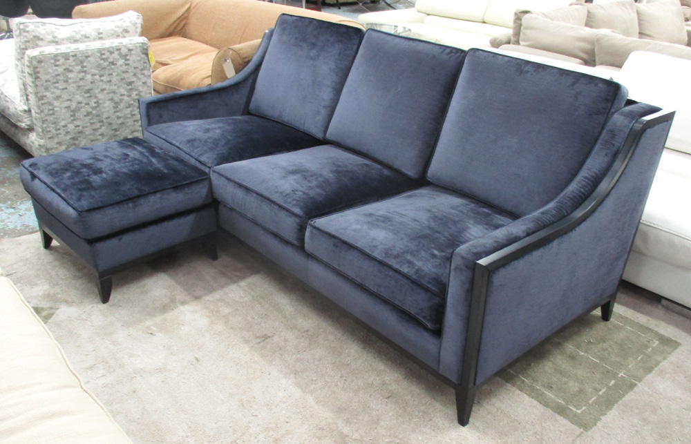 SOFA AND FOOTSTOOL, Contemporary, in a rich Prussian blue velvet with ebonised details.