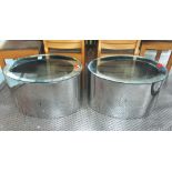 LOW TABLES, a pair, Megaron, polished metal of curved form with glass tops,