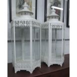 STORM LANTERNS, a pair, cream painted filigree metal frame, 75cm H.