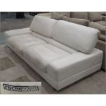 SOFA BY ROCHE BOBOIS, two seater, in an ivory leather with articulated back, 240cm x 104cm x 84cm.