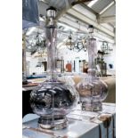 TABLE LAMPS, a pair, in glass with chromed metal mounts, 70cm H.