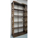 BOOKCASE/DISPLAY STAND, tall proportions finished all around with shelves and trellis supports,