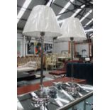 TABLE LAMPS, a pair, chromed metal column style with shades, 65cm H.