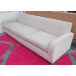 SOFA, three seater, in neutral fabric on square supports, 274cm L.