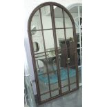 GATED MIRROR, in a bronzed Architectural frame, arched, 169cm x 91cm.