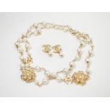 CHANEL PEARL NECKLACE, with gold tone floral details set crystals; plus a pair of Chanel earrings.