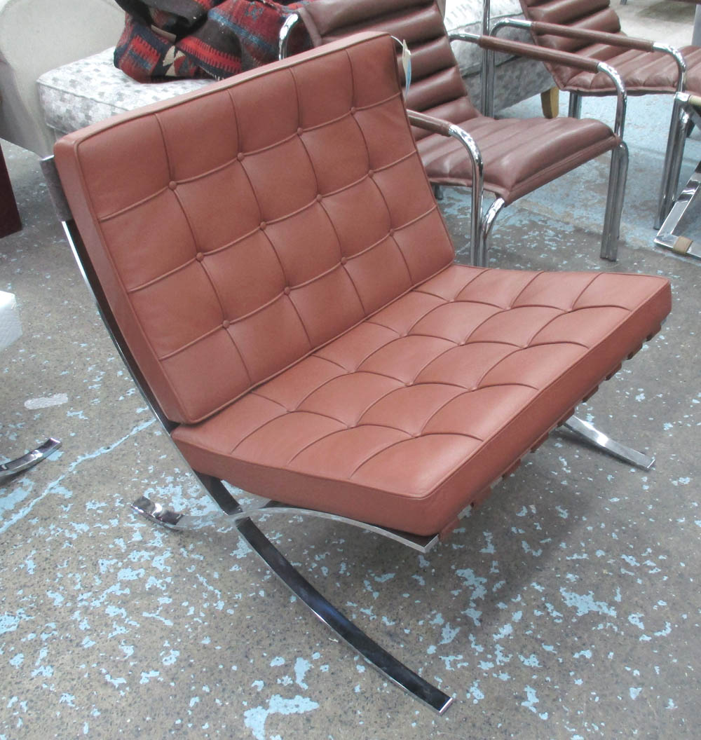 KNOLL BARCELONA CHAIR, in tanned buttoned leather on steel supports, 75cm W.