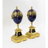 CASSOULETTES, a pair, late 19th century, indigo blue ceramic and enamel decorated,