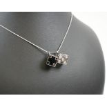 STEFERE 18K WHITE GOLD 'DICE' PENDANT, set forty two black and white diamonds, 16.8grams.