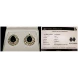 A PAIR OF 18CT WHITE GOLD OVAL BLACK DIAMOND CLUSTER EARRINGS. Black diamonds: 7.