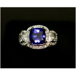 ART DECO STYLE DIAMOND AND TANZANITE RING, mounted in 18ct white gold,