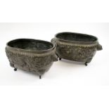 JAPANESE BRONZE JARDINIERES, a pair, Meiji manner each with a raised design of exotic birds,