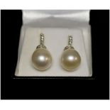 A PAIR OF CULTURED PEARL AND DIAMOND DROP EARRINGS,