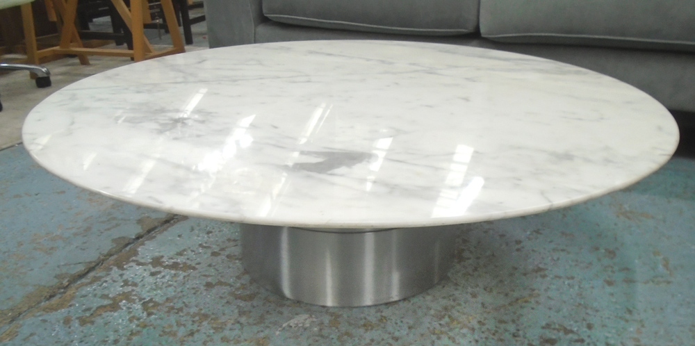 LOW TABLE, circular veined white chamfered marble top, on stepped steel supports,