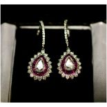 A PAIR OF DIAMOND AND RUBY PEAR DROP EARRINGS, in 18ct white gold,