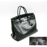 GIO GENCO GREEN CROCODILE HANDBAG, silver tone fitments, padlock and keys, approx. 38cm W.