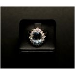 18CT WHITE GOLD, AQUAMARINE AND DIAMOND CLUSTER RING, Aquamarine: 5.25ct, total diamond: 0.77ct.