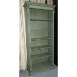 BOOKCASE, green painted with carved detail and open shelves, 191cm x 82cm x 36cm.