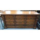 SIDEBOARD, continental style, in burr wood, with multiple drawers and carved split pilasters,