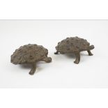 LOBI BRONZE TORTOISE SCULPTURES, a pair, Burkina Faso, cast a concentric circle and boss design,