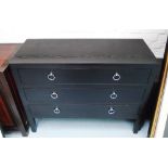 CHEST OF DRAWERS, black, three drawers, wooden, 110cm W x 45cm D x 85cm H.