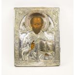 RUSSIAN ICON, depicting St. Nicholas, silver coloured metal oklad, 49cm H x 38cm W.