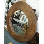 MIRROR, circular in rustic wooden surround, 134cm diam.