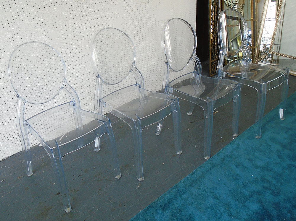 CHAIRS, a set of four, in clear perspex with oval backs, 41cm W.