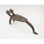 TRIBAL ARTS BRONZE LOBI MALE STOOL, Burkina Faso, of triform with twin headed detail,