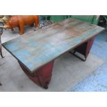 LOW TABLE, with wooden rectangular top on tractor part base, 111cm x 59cm x 48cm H.